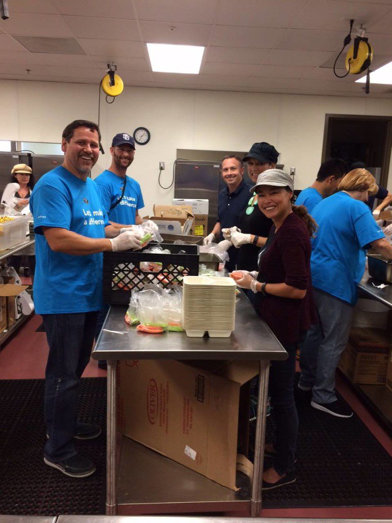 A group of volunteers helping pack means in Mama's Kitchen.